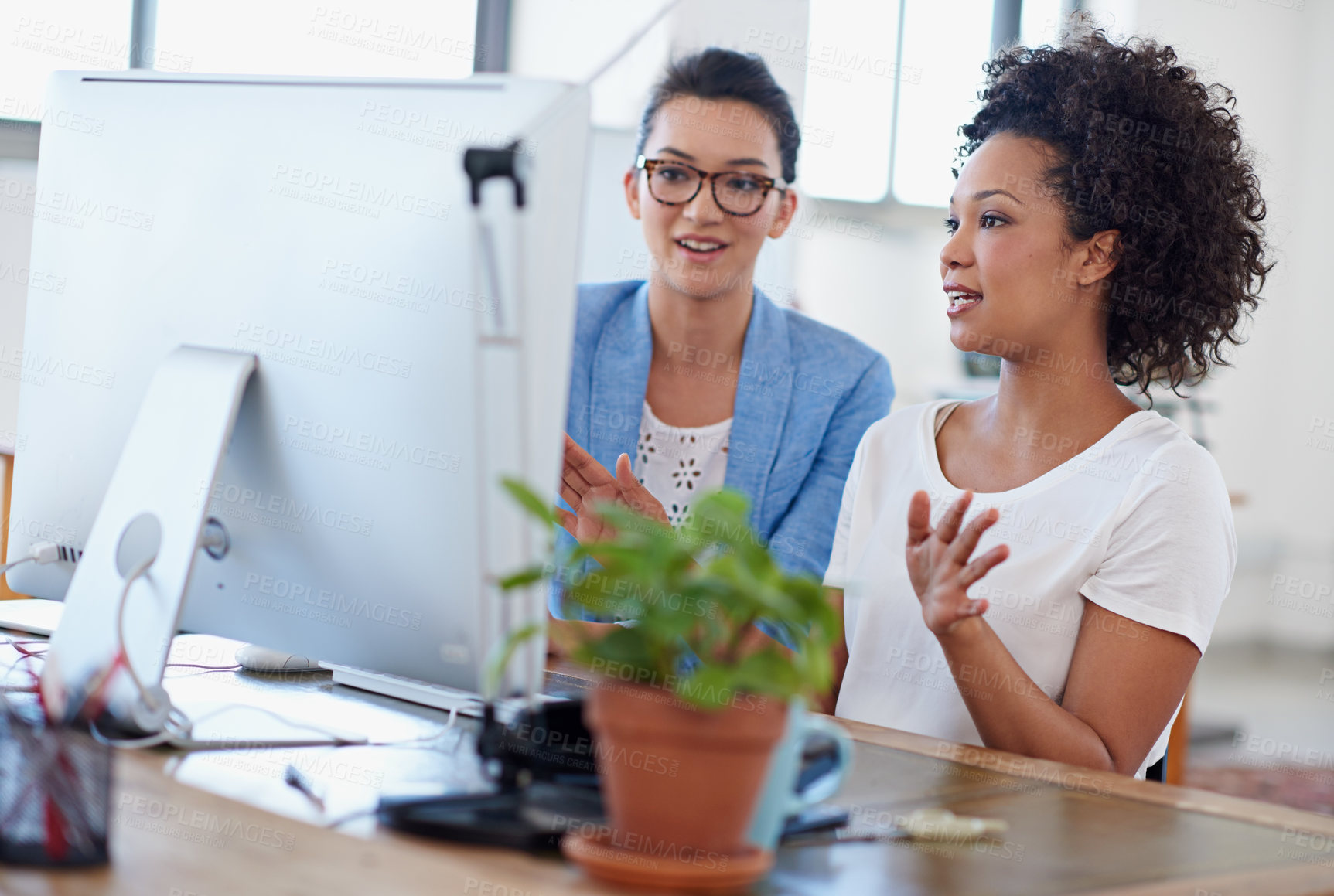 Buy stock photo Women, coworker and computer in office for brainstorming, project or colleague as web designer. Female people, technology and meeting for communication, teamwork or collaboration in digital agency