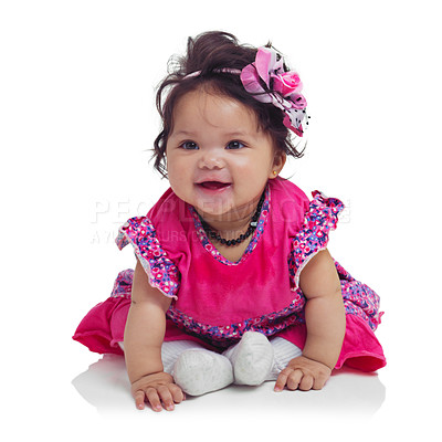 Buy stock photo Innocent, cute and happy baby girl in a studio with a floral, beautiful and flower outfit and headband. Happiness, smile and infant child sitting and playing while isolated by a white background.