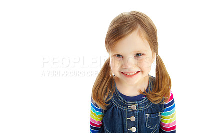 Buy stock photo Portrait of a little girl with pigtails smiling while isolated against a white background