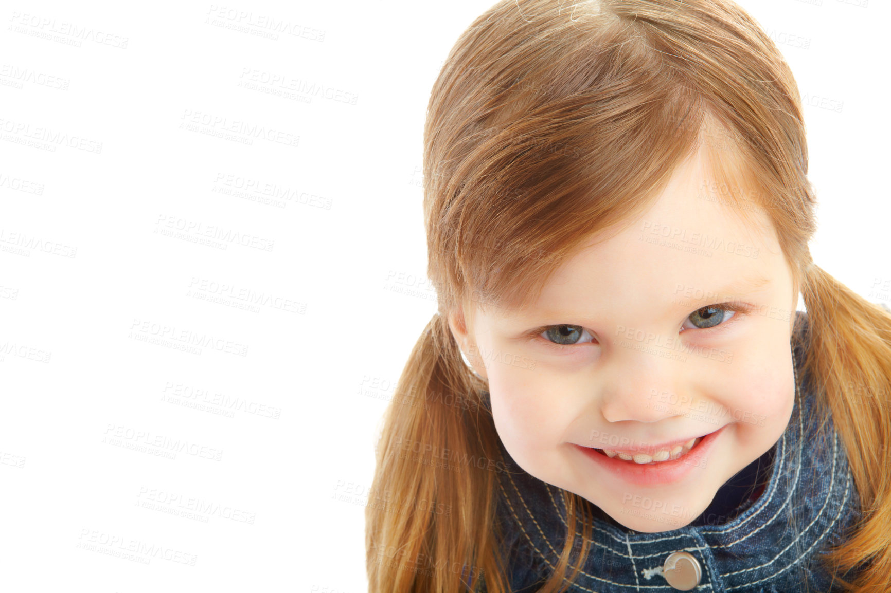 Buy stock photo Portrait of a little girl with pigtails smiling while isolated against a white background