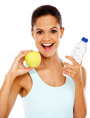 Buy stock photo Portrait of a happy young woman holding an apple and a bottle of water