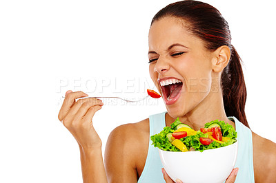 Buy stock photo Portrait of an attractive young woman eating a healthy salad with her eyes closed