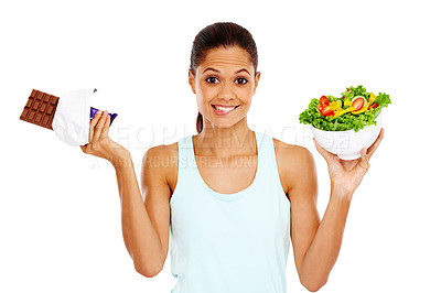 Buy stock photo Portrait of an attractive young woman choosing between a healthy salad an a chocolate slab