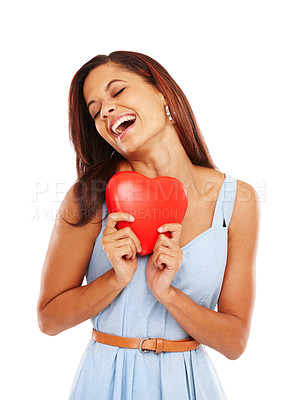 Buy stock photo Young woman holding a red heart and smiling against a white background