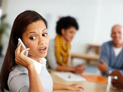 Buy stock photo Business people, emergency and woman on a phone call in a meeting talking, communication or speaking in an office. Problem, crisis and stressed employee listening to bad news in a business meeting