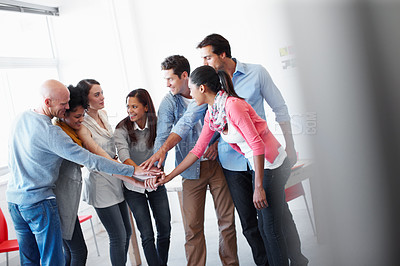 Buy stock photo Happy, motivation and holding hands for teamwork at startup for cooperation, solidarity and goal. Partnership, strategy or support of marketing people excited for new venture together at company.