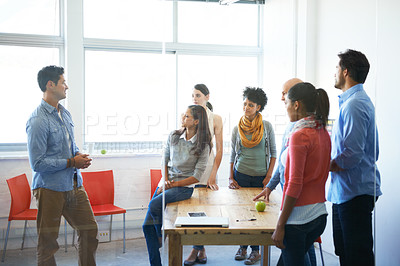 Buy stock photo Shot of a group of casually dressed businesspeople in the office