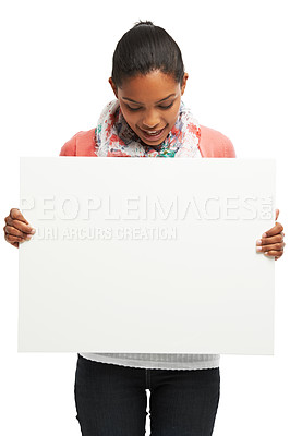 Buy stock photo Casual young woman holding white copyspace against a white background
