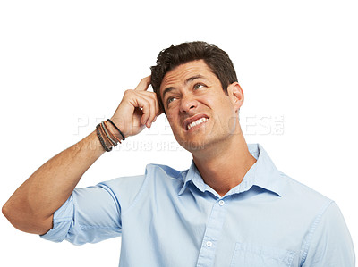 Buy stock photo A handsome young man scratching his head while isolated on a white background