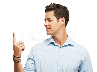 Buy stock photo A handsome young man spinning something on his finger while isolated on white