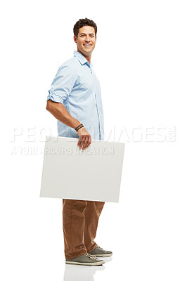 Buy stock photo Mockup, poster and portrait of happy man in studio for news, announcement and information. Space, promotion and isolated person with sign, banner and billboard for advertising on white background