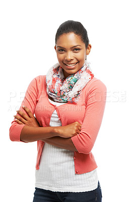 Buy stock photo Portrait of a pretty smiling young woman standing with arms crossed against a white background