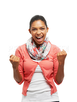 Buy stock photo Portrait of a smiling young woman standing with fists clenched in victory