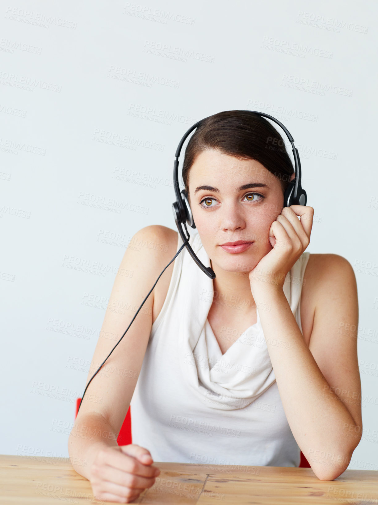 Buy stock photo Headset, call center and bored woman in office with telemarketing, customer service or crm. Tired, contact us and young female technical support agent with outbound consultation at help desk.