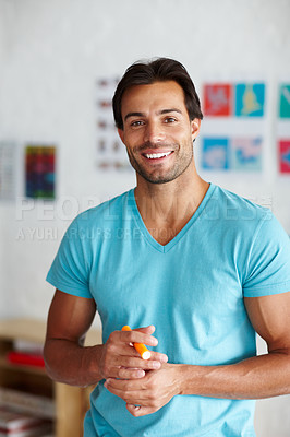 Buy stock photo A handsome young man looking at the camera 