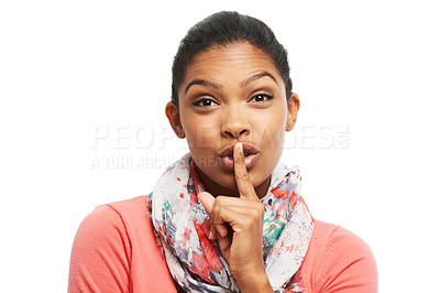 Buy stock photo A beautiful young woman holding her finger against her lips