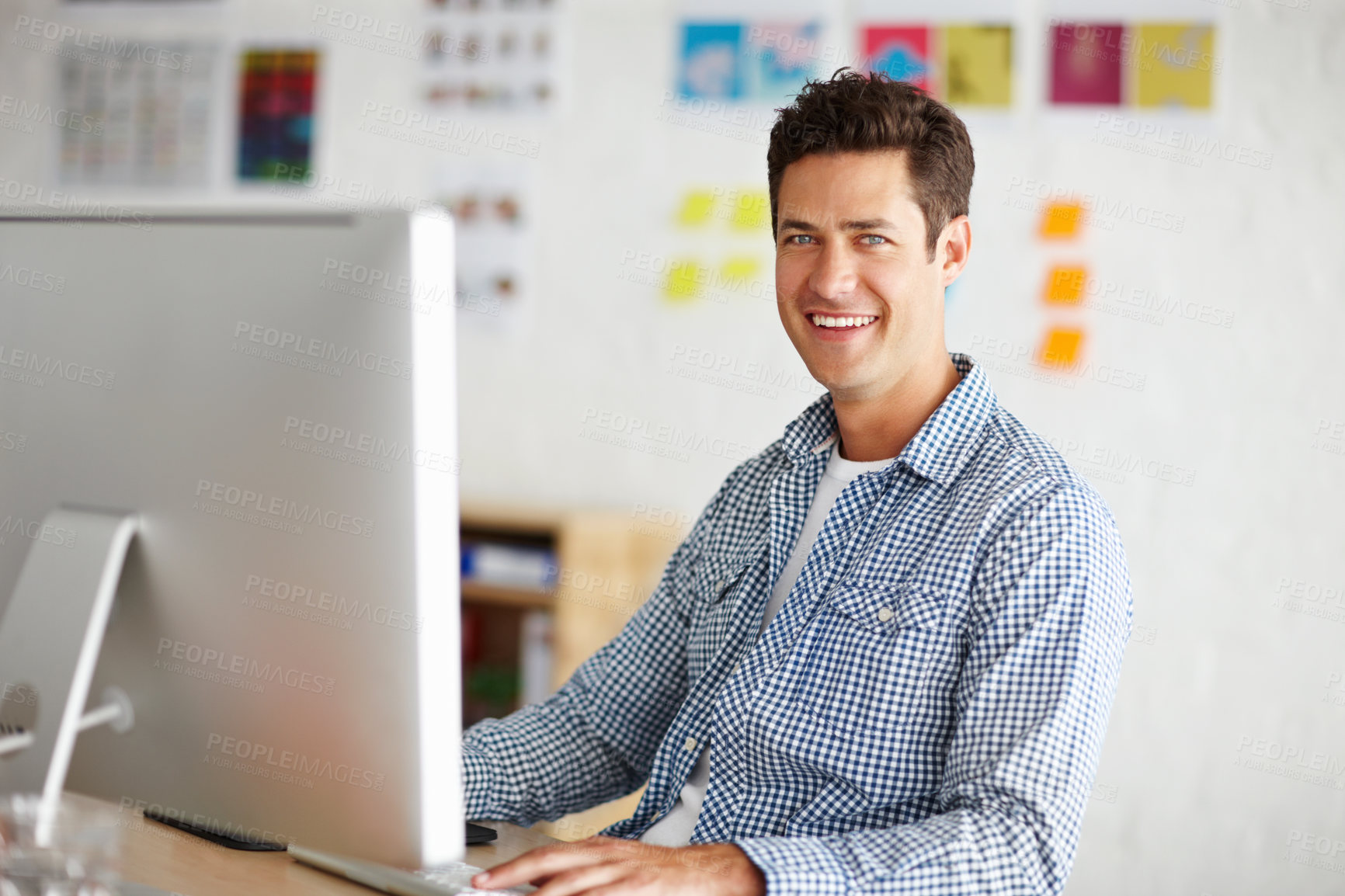 Buy stock photo Graphic designer, man and portrait in office with computer for process, smile and problem solving at company. Person, employee and happy with pc for project management at creative agency in Spain