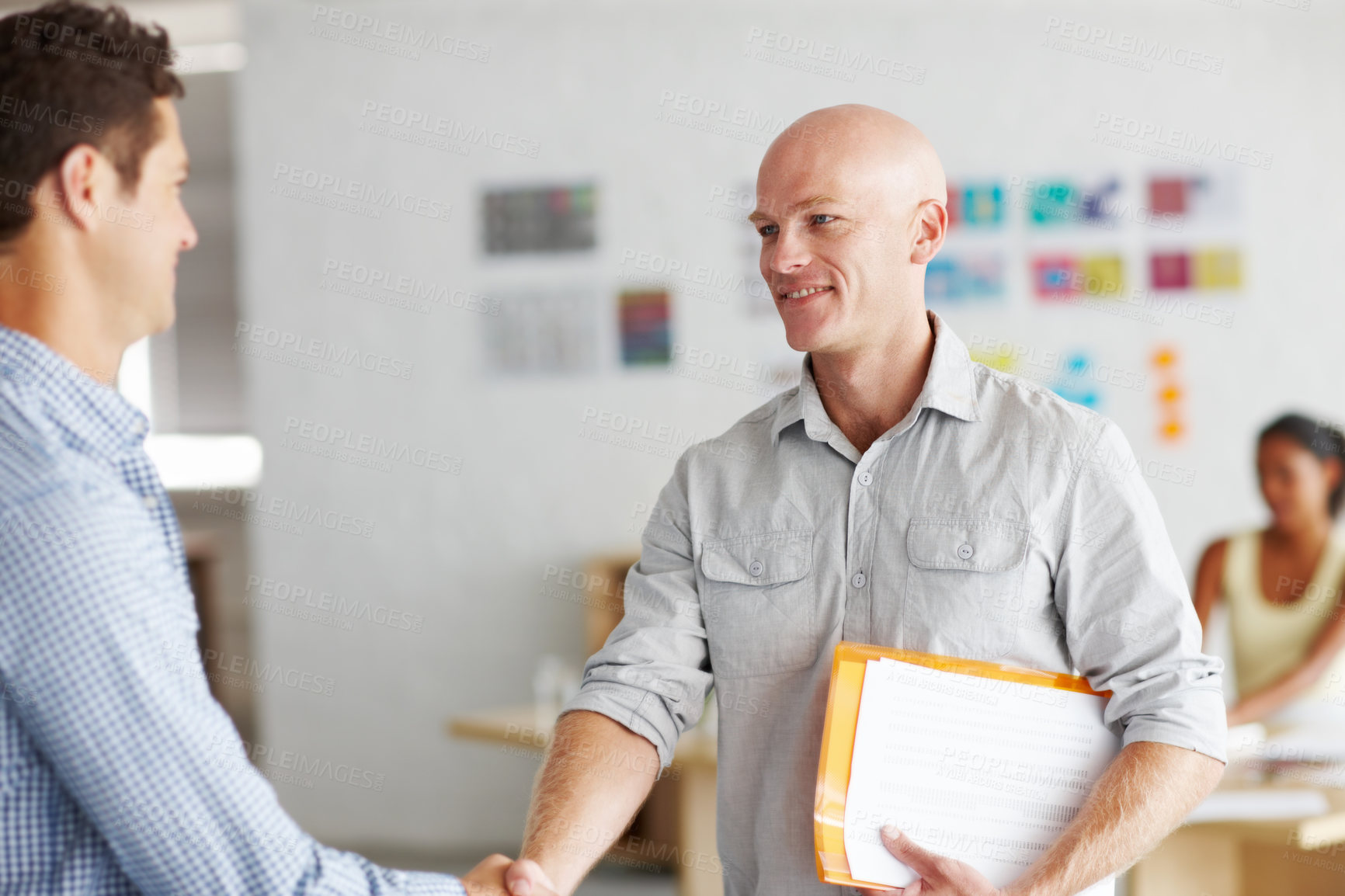 Buy stock photo Happy men, meeting and introduction with handshake for creative partnership, agreement or deal at office. Young businessman shaking hands with colleague in teamwork for thank you, welcome or startup