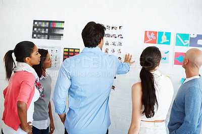Buy stock photo Shot of a group of casually dressed businesspeople in the office