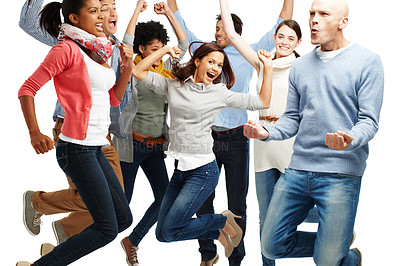 Buy stock photo Studio shot of a diverse group of vibrant young people jumping into the air isolated on white