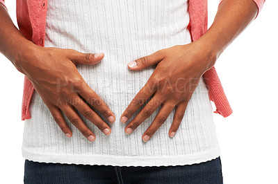 Buy stock photo Cramps, period pain and hands on stomach of woman in studio with worry, hurt and injury on white background. Sick, abdominal and isolated person for tummy ache, menstrual discomfort and constipation