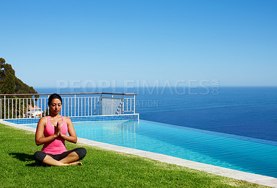 Buy stock photo Meditation, yoga and woman on grass by pool for holistic fitness, mindfulness and breathing exercise. Summer, hands in prayer and person by ocean for wellness, health and zen energy outdoors