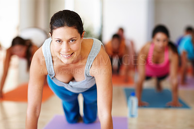 Buy stock photo Fitness, yoga and portrait of personal trainer with class for stretching, exercise and workout on mat. Pilates, club and instructor with men and women push up for wellness, balance and healthy body