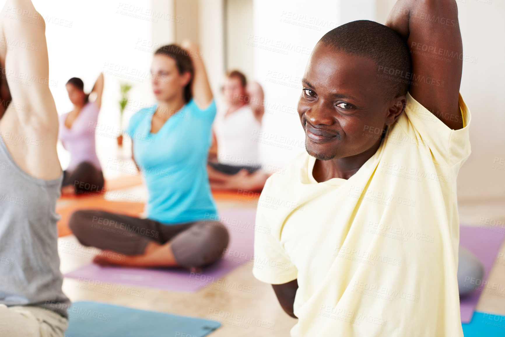 Buy stock photo Portrait, stretching and relax, black man in yoga class with smile, commitment and body wellness. Mindfulness, men and women in holistic club together with people, balance and fitness with pilates.