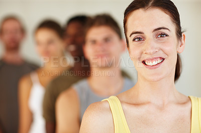 Buy stock photo Portrait, smile or fitness and a woman with a group of people in a studio for health or wellness. Exercise, training and happy with a confident young person in gym class for the start of a workout