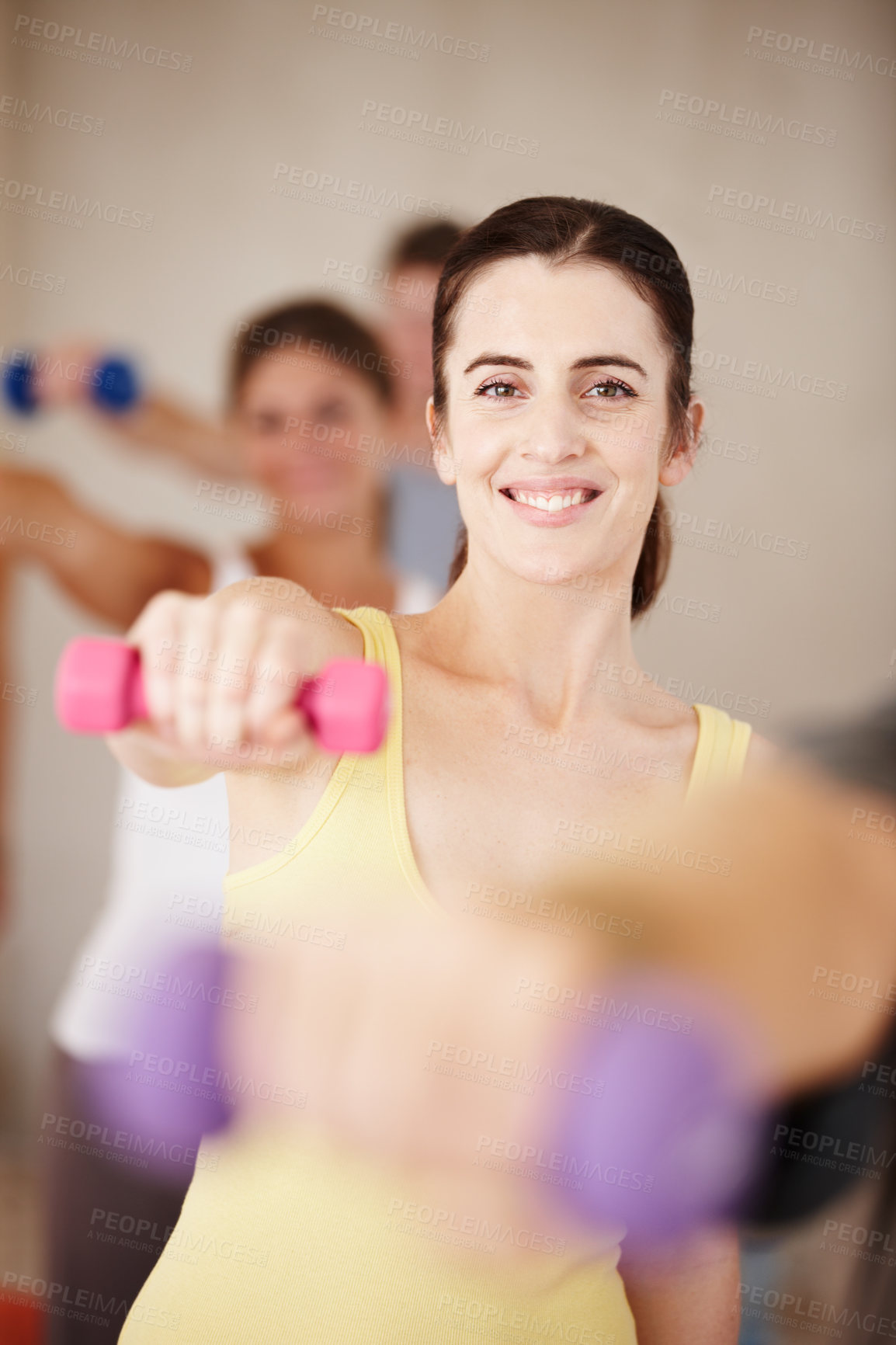 Buy stock photo Girl, dumbbell and portrait in pilates class with smile, fitness and exercise for muscle development at gym. Woman, weightlifting and group of people, happy and progress with training in Ireland