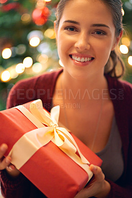 Buy stock photo Woman portrait, Christmas gift and holiday celebration, happy smile and tree with decoration in background in home. Female, box present and ribbon with happiness, excited and enjoy festive xmas event