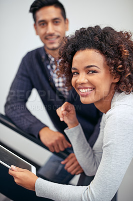 Buy stock photo Portrait of two colleagues using a digital tablet while standing in a stairwell
