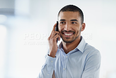 Buy stock photo Cropped shot of a handsome young businessman using in cellphone in the office