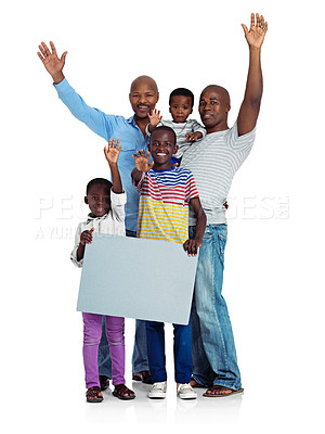 Buy stock photo Studio shot of two african men with their kids holding a blank board, isolated on white
