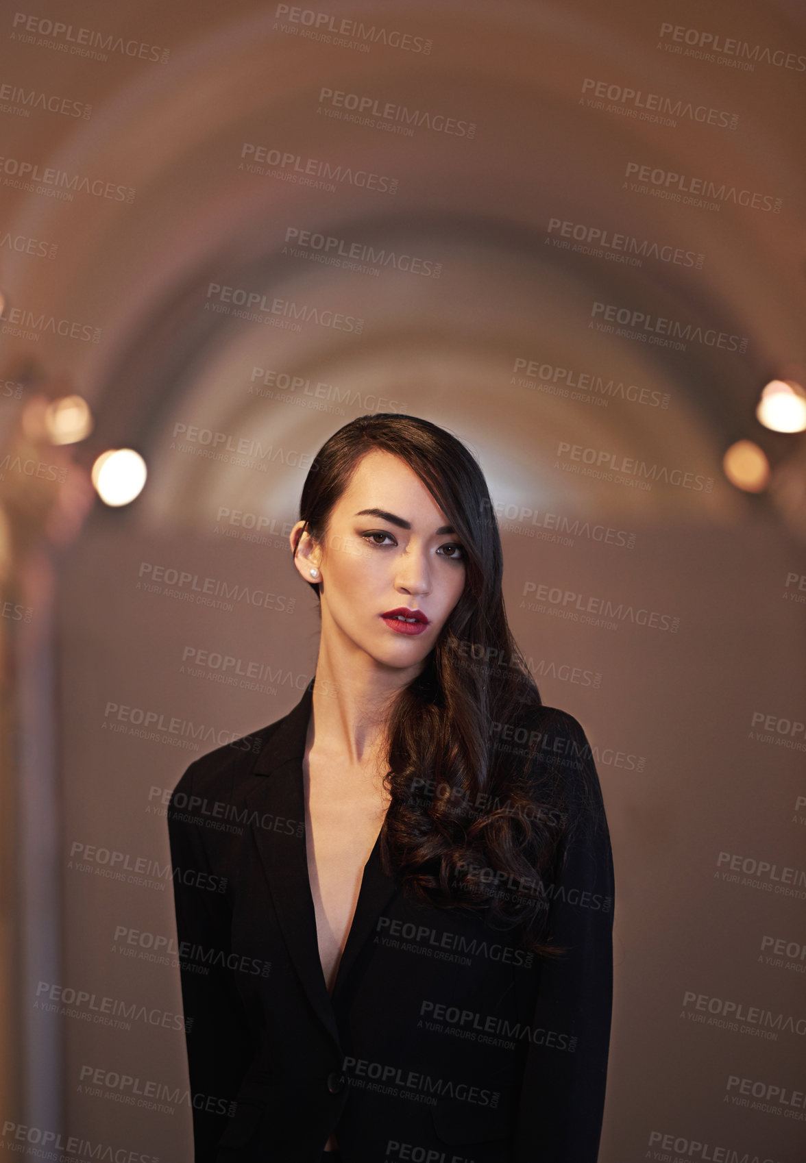 Buy stock photo Shot of an attractive and elegant young woman in a  luxurious setting