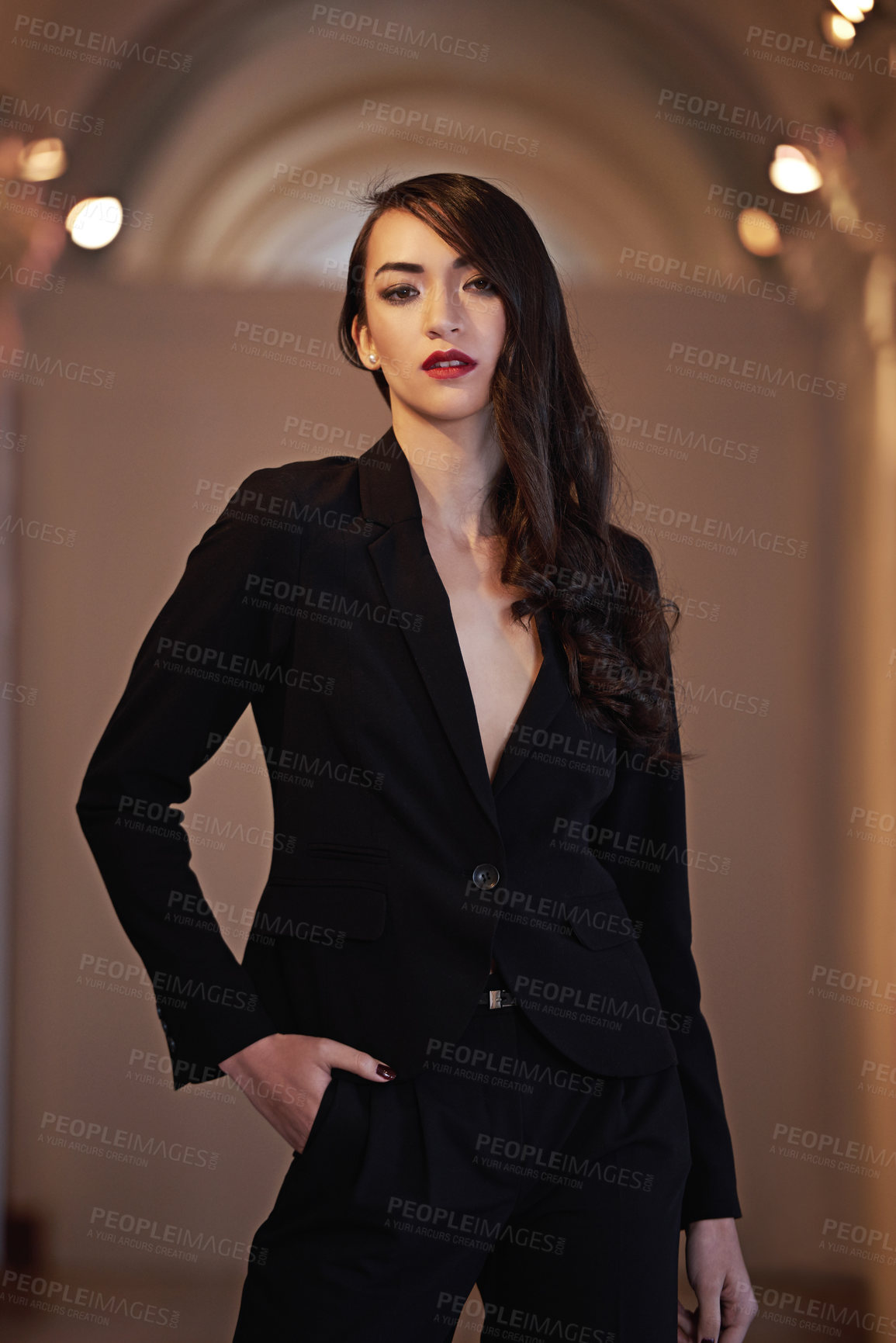 Buy stock photo Shot of an attractive and elegant young woman in a  luxurious setting