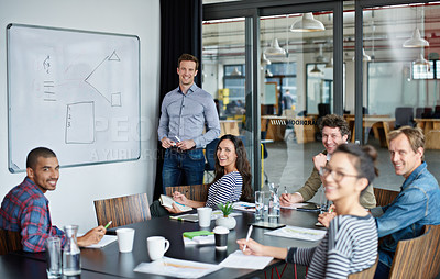 Buy stock photo Shot of a group of colleagues in a presentation in a boardroom