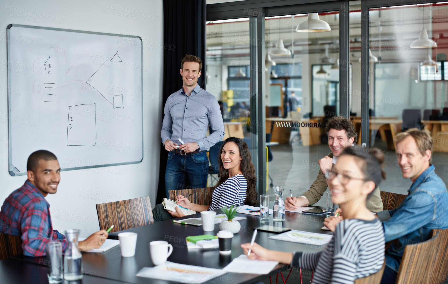 Buy stock photo Shot of a group of colleagues in a presentation in a boardroom