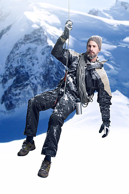 Buy stock photo Shot of a mountaineer hanging from a rope on a rockface