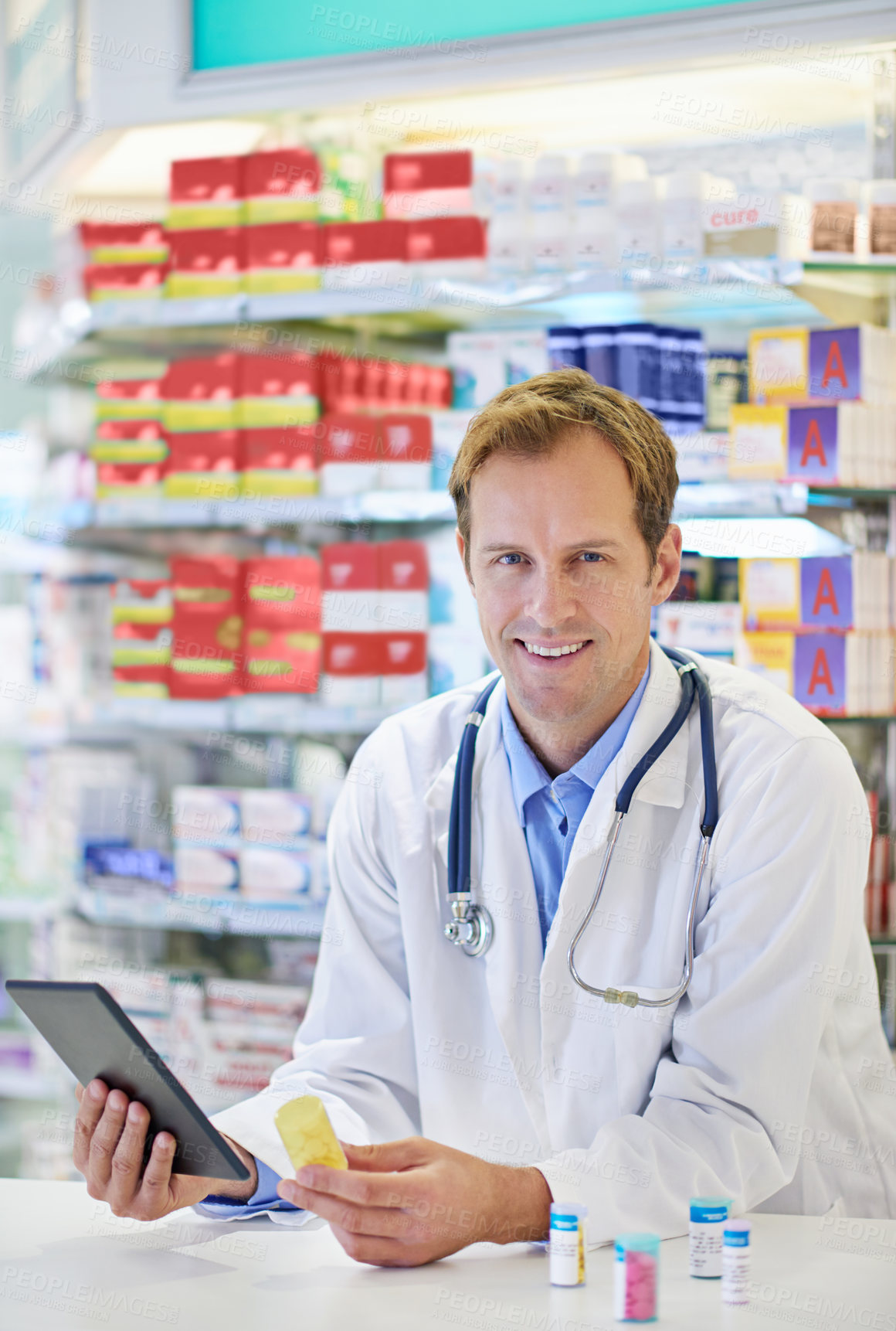 Buy stock photo Pharmacist, tablet and pharmaceuticals for telehealth, portrait or medicine in drugstore, chemist or services. Male person, doctor and pills in clinic for stock, inventory for information or advice