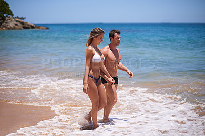 Buy stock photo Date, walking or happy couple holding hands at beach for travel, holiday or fun vacation with water or bikini in Miami. Outdoor, romantic or people at ocean or sea for honeymoon bonding or wellness