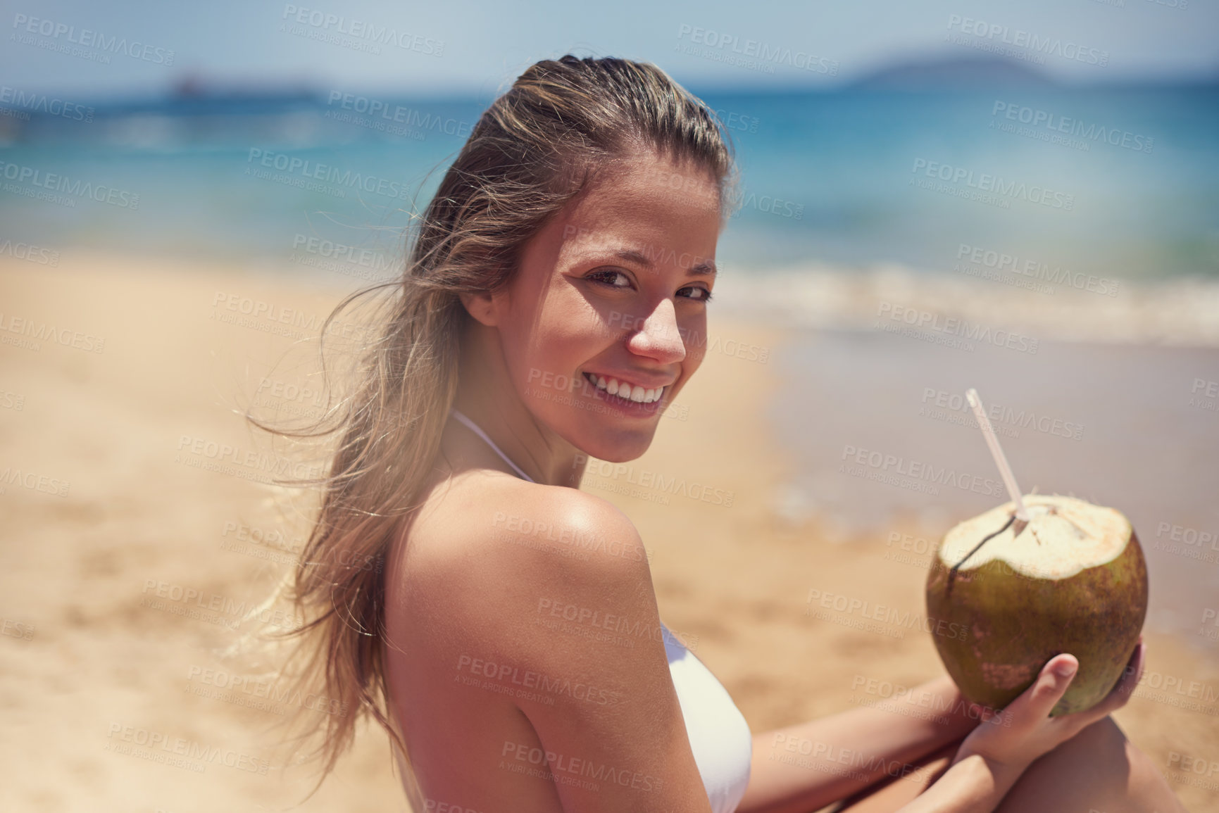 Buy stock photo Portrait, travel or happy woman at beach for coconut drink, holiday or vacation with beverage or nature in Hawaii. Smile, relax and girl at ocean or sea in summer for tanning or tropical adventure