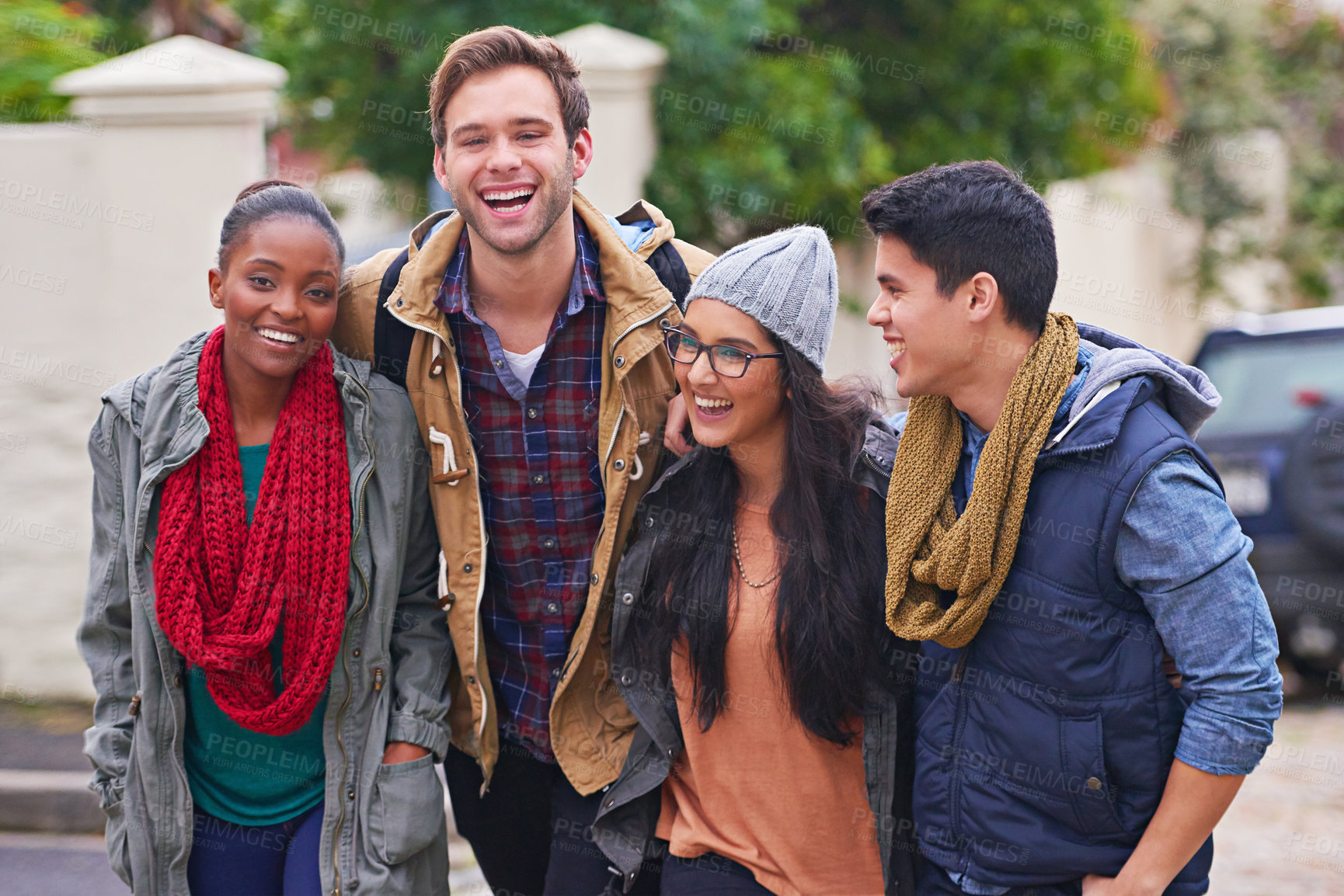 Buy stock photo Shot of a group of happy college students hanging out on campus
