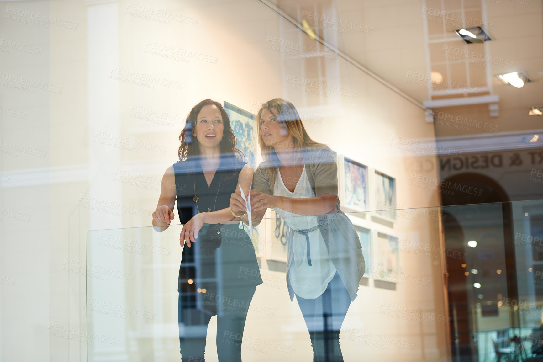 Buy stock photo Women, friends together and exhibition at gallery, conversation and culture appreciation. Woman, art critic partnership and looking in museum with talk, lifestyle and ideas by window with reflection