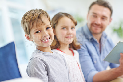 Buy stock photo Education, learning or reading with father and kids on sofa in living room together for bonding or study. Book, literature or storytelling with children and dad in apartment for development or growth