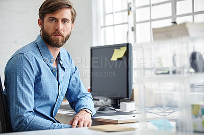 Buy stock photo Portrait of a serious designer sitting in his office