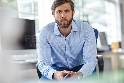 Buy stock photo Portrait of a serious designer in his office