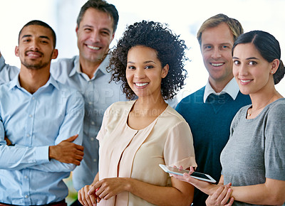 Buy stock photo Portrait of a group of smiling coworkers standing in anoffice