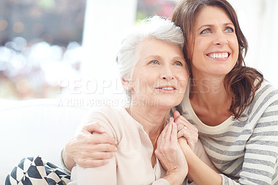 Buy stock photo Shot of a loving mother and daughter spending time together at home