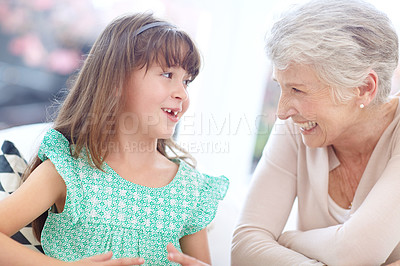 Buy stock photo Shot of a loving grandmother and granddaughter spending time together at home